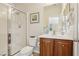 Bathroom featuring a glass enclosed shower, wood vanity, and framed mirror with modern finishes at 8316 Imperial Lakes St, Las Vegas, NV 89131