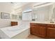 Bright bathroom showcasing a large soaking tub with dual vanities and a well-lit, neutral color scheme at 8316 Imperial Lakes St, Las Vegas, NV 89131
