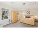 Bright bedroom with a double bed, and two large windows letting in natural light at 8316 Imperial Lakes St, Las Vegas, NV 89131
