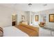 Bright bedroom with a double bed, sitting chair and en-suite bathroom at 8316 Imperial Lakes St, Las Vegas, NV 89131