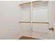 Walk-in closet with built-in shelving and rods for ample storage space, carpeted floors, and neutral walls at 8316 Imperial Lakes St, Las Vegas, NV 89131
