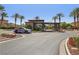 Gated community entrance featuring stone accents, desert landscaping, and security features at 8316 Imperial Lakes St, Las Vegas, NV 89131