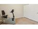 Bright exercise room with an exercise bike, carpet floors, and a closet with sliding doors at 8316 Imperial Lakes St, Las Vegas, NV 89131