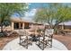Backyard fire pit with seating, surrounded by desert landscaping, perfect for outdoor entertaining at 8316 Imperial Lakes St, Las Vegas, NV 89131