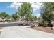 A sidewalk in the community, with a street view, mature trees, and landscaping at 8316 Imperial Lakes St, Las Vegas, NV 89131