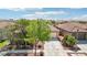 Well-maintained single-story home with a two-car garage, desert landscaping, and a concrete driveway at 8316 Imperial Lakes St, Las Vegas, NV 89131