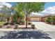 Charming single-story home with mature landscaping, a well-kept lawn, and a spacious two-car garage at 8316 Imperial Lakes St, Las Vegas, NV 89131