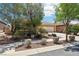Charming single-story home with mature trees, manicured landscaping, and an attached two-car garage at 8316 Imperial Lakes St, Las Vegas, NV 89131