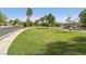 Lush green space with benches and manicured landscaping, offering a relaxing spot within the community at 8316 Imperial Lakes St, Las Vegas, NV 89131