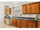 Kitchen with stainless steel appliances, granite counters, and wood cabinets at 8316 Imperial Lakes St, Las Vegas, NV 89131