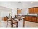 Kitchen island with granite countertop and bar stool seating at 8316 Imperial Lakes St, Las Vegas, NV 89131