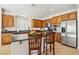 Kitchen featuring granite counters, stainless appliances and breakfast bar at 8316 Imperial Lakes St, Las Vegas, NV 89131