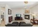 Inviting living room with cozy fireplace, neutral tones and tile flooring at 8316 Imperial Lakes St, Las Vegas, NV 89131