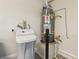 Water softener and water heater in a utility room, showing the home's systems at 8316 Imperial Lakes St, Las Vegas, NV 89131