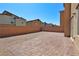 A private backyard featuring an installed brick patio surrounded by a sturdy brick wall at 8324 S Miller Ln, Las Vegas, NV 89113