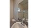 Bathroom featuring a granite countertop, white sink, and glass-enclosed shower at 8324 S Miller Ln, Las Vegas, NV 89113