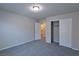 Well-lit bedroom with a closet and an open door that shows the bathroom at 8324 S Miller Ln, Las Vegas, NV 89113