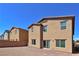 This home has a brick patio and a neutral stucco exterior with a sturdy brick wall surround at 8324 S Miller Ln, Las Vegas, NV 89113