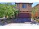 Charming two-story home with brick paved driveway and desert landscaping for low maintenance appeal at 8324 S Miller Ln, Las Vegas, NV 89113