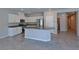 Well-equipped kitchen featuring granite countertops, modern appliances, and a center island at 8324 S Miller Ln, Las Vegas, NV 89113