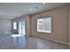 Living area with tile floors, sliding glass door to backyard and bright windows at 8324 S Miller Ln, Las Vegas, NV 89113