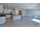 Bright, open-concept living space with island and granite countertops connected to kitchen at 8324 S Miller Ln, Las Vegas, NV 89113
