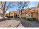 View of the house with a covered patio and low-maintenance rock landscaping at 8808 Litchfield Ave, Las Vegas, NV 89134