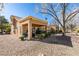 View of the house with a covered patio and low-maintenance rock landscaping at 8808 Litchfield Ave, Las Vegas, NV 89134