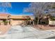 Single-story home with a two-car garage and a well-kept, xeriscaped front yard at 8808 Litchfield Ave, Las Vegas, NV 89134
