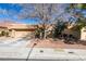 Charming single-story home with a well-maintained front yard and a two-car garage at 8808 Litchfield Ave, Las Vegas, NV 89134