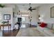 Bright living room featuring dark wood floors, neutral paint, high ceilings, and natural light at 8808 Litchfield Ave, Las Vegas, NV 89134