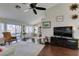Bright living room featuring dark wood floors, neutral paint, high ceilings, and natural light at 8808 Litchfield Ave, Las Vegas, NV 89134