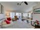 Bright living room featuring dark wood floors, neutral paint, high ceilings, and natural light at 8808 Litchfield Ave, Las Vegas, NV 89134