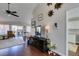 Bright living room boasts a neutral color scheme, dark wood floors, and modern ceiling fan at 8808 Litchfield Ave, Las Vegas, NV 89134