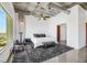 Bedroom features a concrete ceiling, city views, and modern decor and opens to large closet at 900 Las Vegas Blvd # 1014, Las Vegas, NV 89101