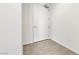 Minimalist entryway featuring a white front door, smooth concrete floors and plain white walls at 900 Las Vegas Blvd # 1014, Las Vegas, NV 89101