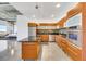 Well-lit kitchen boasts modern wood cabinetry, stainless appliances, and a center island with a black countertop at 900 Las Vegas Blvd # 1014, Las Vegas, NV 89101