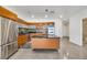 Contemporary kitchen featuring stainless steel appliances, wood cabinetry, and a functional center island at 900 Las Vegas Blvd # 1014, Las Vegas, NV 89101