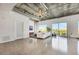 Spacious living room boasting concrete ceilings and windows with city views at 900 Las Vegas Blvd # 1014, Las Vegas, NV 89101
