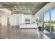 Spacious living room boasts concrete ceilings, fireplace, and balcony overlooking city views at 900 Las Vegas Blvd # 1014, Las Vegas, NV 89101