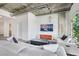 Bright living room features concrete ceilings, fireplace, modern lighting and comfortable white sofa at 900 Las Vegas Blvd # 1014, Las Vegas, NV 89101