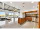 Modern living room open to kitchen, featuring sleek concrete floors and expansive city views from large windows at 900 Las Vegas Blvd # 1014, Las Vegas, NV 89101