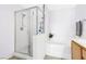 Bright bathroom featuring a glass shower enclosure and a soaking tub at 9013 Meisenheimer Ave, Las Vegas, NV 89143