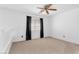 Bright bedroom featuring white walls, plush carpet and a window with stylish curtains at 9013 Meisenheimer Ave, Las Vegas, NV 89143