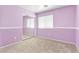 Cozy bedroom featuring plush carpet, natural light, and a mirrored closet at 9013 Meisenheimer Ave, Las Vegas, NV 89143