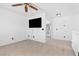 Spacious bonus room featuring white walls, plush carpet, and a large flatscreen TV at 9013 Meisenheimer Ave, Las Vegas, NV 89143