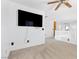 Spacious bonus room featuring white walls, plush carpet, and a large flatscreen TV at 9013 Meisenheimer Ave, Las Vegas, NV 89143