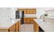 Spacious kitchen featuring stainless steel fridge, ample counter space and wood cabinets at 9013 Meisenheimer Ave, Las Vegas, NV 89143