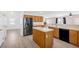Spacious kitchen with stainless steel appliances, wood cabinets, and center island at 9013 Meisenheimer Ave, Las Vegas, NV 89143