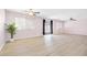 Large living room with plenty of natural light and wood-look floors at 9013 Meisenheimer Ave, Las Vegas, NV 89143